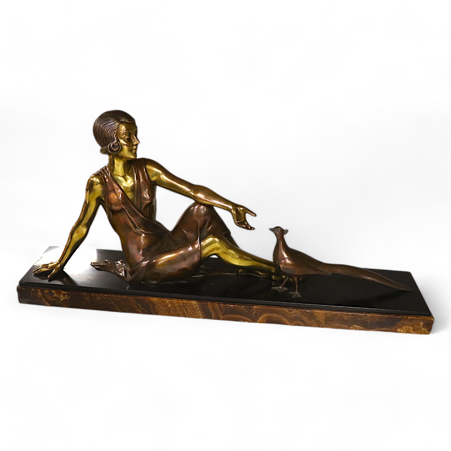 An Art Deco figural bronze of a girl with a peacock, VRAI Bronze foundry mark, signed Godard, on a marble base, base 65cm long, 30cm high. Condition - fair to good